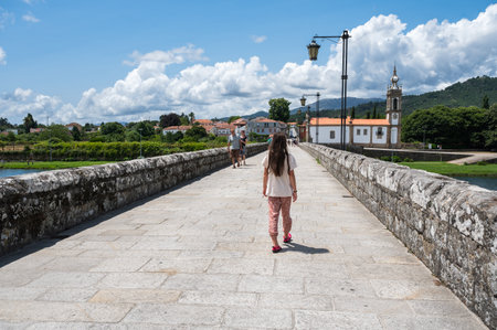 Ponte de Lima, Portugal - July 06 2023: People walking on the bridge in Ponte de Lima, town in Northern Portugal near Viana do Casteloのeditorial素材