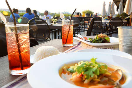 Lifestyle in restaurant or bar table with plate for peoples talking on background 0445の写真素材