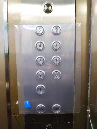 Bangkok - Thailand. March 30, 2020. The coronavirus disease 2019 (COVID-19), The push button in the passenger lift covers the plastic after finding the corona virus epidemicのeditorial素材
