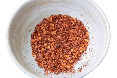 Cayenne pepper in a bowl on a white background , Food ingredients in Asiaの写真素材
