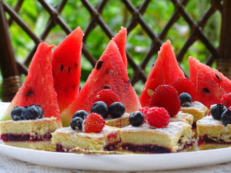 watermelon and cakes with berries