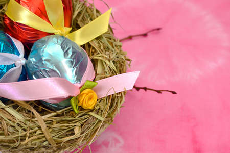 Easter eggs with satin ribbonの写真素材