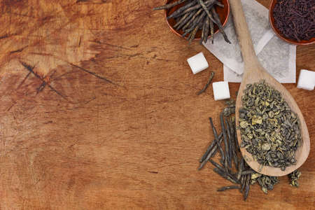 Tea brew in a wooden spoon and podsの写真素材