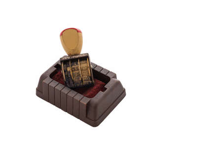 Date stamper put isolated on whiteの写真素材