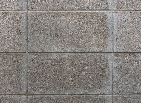 Cement brick walls form a line around