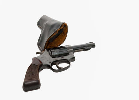 Black gun with holster . Contaminated fingerprints placed on a white backgroundの写真素材