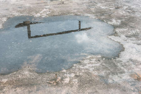 Water stains on the cement floor and reflectionの写真素材