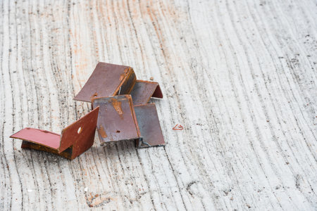 Several pieces of scrap iron rods placed on the concrete floor.の写真素材