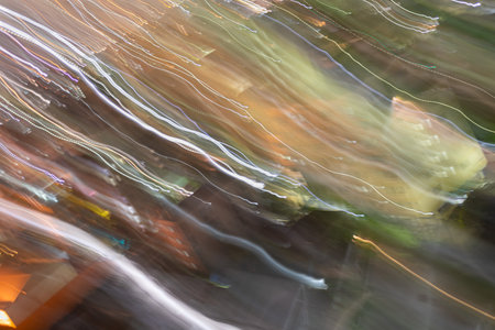 Photos of light and color in the city during the night caused by camera movement(out of focus)の写真素材