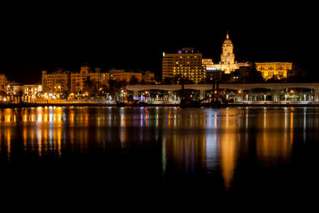 Malaga Harbour city reflection on the waterの写真素材
