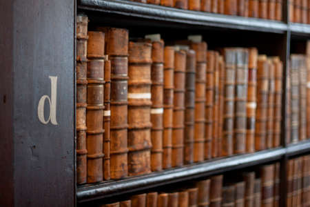 Book shelves with historic books at Trinity College Library "The Long Room", Dublin, Ireland のeditorial素材