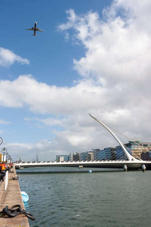DUBLIN, IRELAND - SEPT 15: FlightFest over Samuel Beckett Bridge in Dublin Ireland on September 15, 2013: This fest is a exhibition of plane in Dublin. のeditorial素材