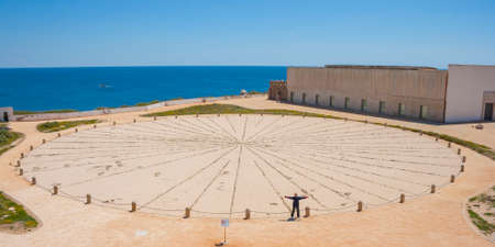 Woman at Big Sunclock in Fort of Sagres, Algarve. Portugalの写真素材