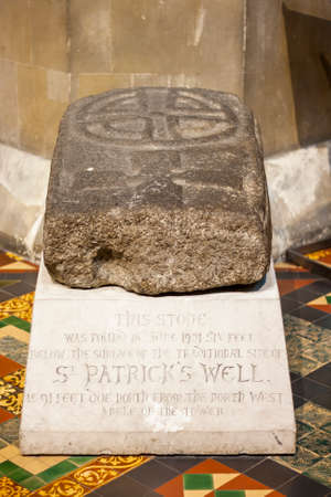 Stone with The Saint Patricks Cross found near to The Saint Patricks Cathedral in Dublin, Irelandのeditorial素材
