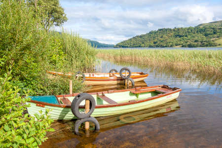 Boats in The Glencar lake in Irelandの写真素材
