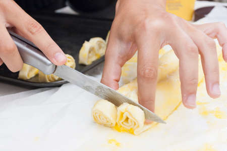 Cutting the puff to make sweet heart biscuitの写真素材