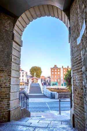 View of Hapenny Bridge from Merchants Arch in Dublin, Ireland