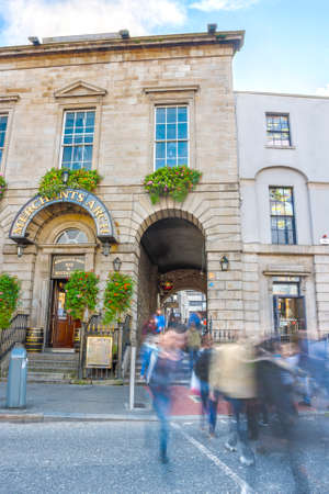 Dublin, Ireland - Oct 18, 2014: People crossing the street from Merchnts Arch to Hapenny in Dublin, Ireland on October 18, 2014のeditorial素材