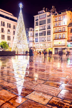 Malaga, Spain - Dec 20, 2014: View of Christmas tree and people at Constitution square next to Larios street in Malaga, Spain on December 20, 2014のeditorial素材
