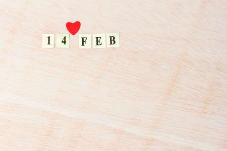 14 Feb, Valentine's day on blonde wooden background