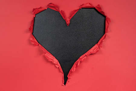 Heart with red frame and blackboard backgroundの写真素材