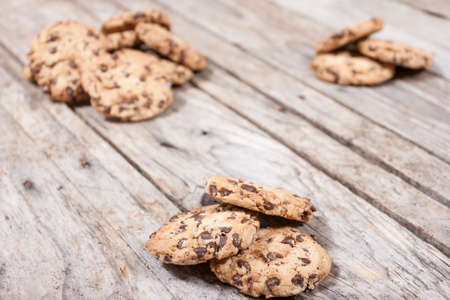 Homemade chocolate chip cookies on wooden background