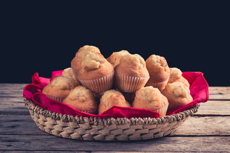 Closeup of fresh homemade cupcake in a basketの写真素材