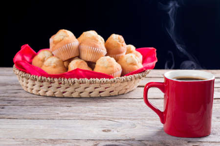 Hot coffee and cupcakes ready for breakfastの写真素材