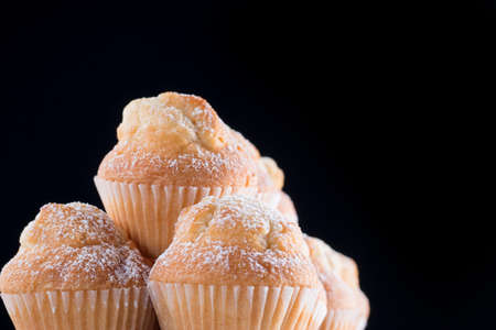 Closeup ofa pyramid of fresh homemade cupcake