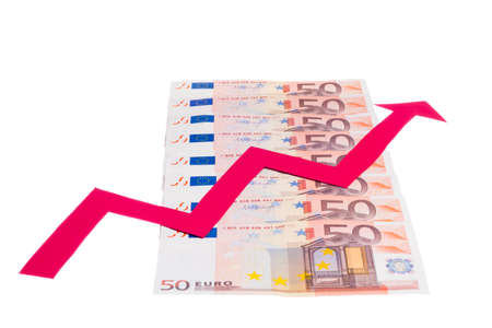 Concept of increase of euro value with red arrow growing over notes row isolated on white backgroundの写真素材