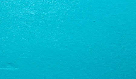 Closeup of a turquoise textured wall pattern