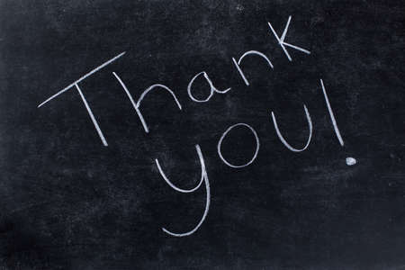 Thank you! written on black chalkboard bacgroundの写真素材