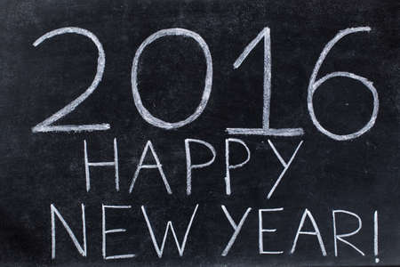 Happy new year 2016, written on black chalkboardの写真素材
