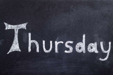 Thursday written on white on black chalkboard background