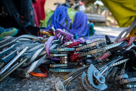 Close-up different carabines for mountaineering on ropes placed on rock