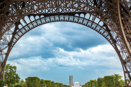 Panoramic view to bottom of Eiffel tower in cloudy day