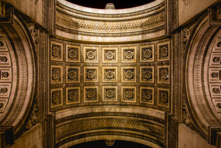 From below shot of ornamental stone dome of Arc de Triumph with amazing architectural decorationの写真素材