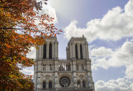 Exterior shot of medieval monument of Notre-Dame Cathedral on background of blue sky