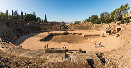 Merida, Spain - Oct 28, 2017: Unrecognizable tourists taking excursion on historic ruins of Roman...