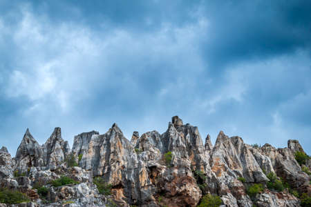 From below big cliffs and cloudy sky in nature in Cerro del Hierro, Seviileの写真素材
