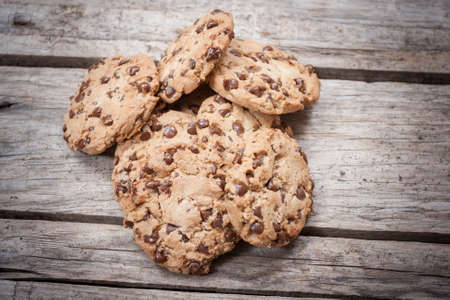 Homemade chocolate chip cookies on wooden background