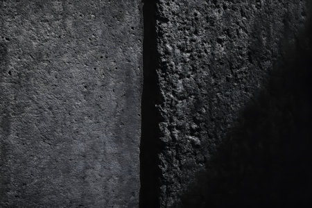Black concrete wall texture. Abstract background for design with copy space.の素材