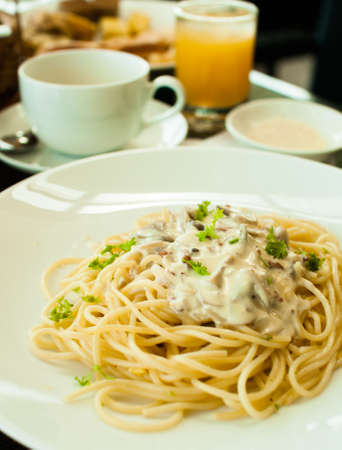 Pasta carbonara with juice and teaの写真素材