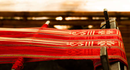 Loom with red textileの写真素材