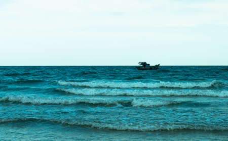 Seascape with ship on sea wavesの写真素材