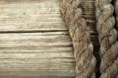 Ship rope and copy space old wooden teture backgroundの写真素材