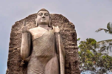 COLOMBO/SRI LANKA - March 17 2018:  Replica of Aukana Buddha Statue in Colombo.  Majestic Buddha statue  against the sky with hand upのeditorial素材