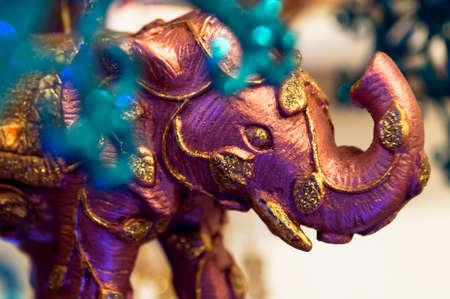 Pink elephant with gold as a Christmas tree decoration closeup viewの写真素材