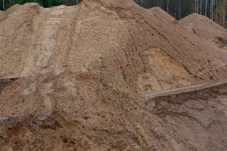 a beautiful guarantor of a quarry with brown sand and rare large stonesの写真素材