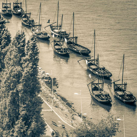 Typical rabelo boats from high point of view in Porto, Portugal. High angle view to Douro river.の写真素材